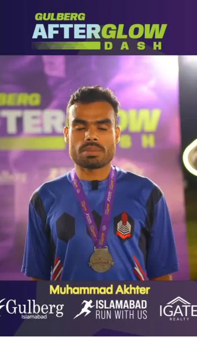 Post-event testimonial still: Muhammad Akhter wearing his finisher medal